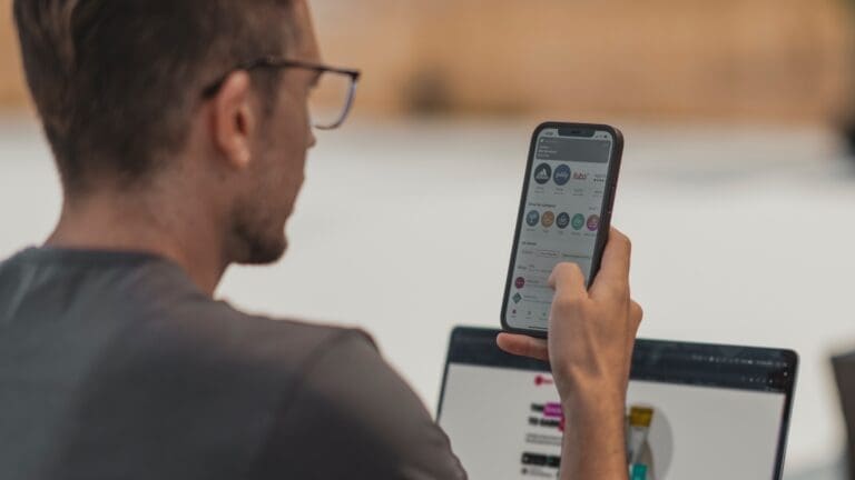 man on phone with laptop