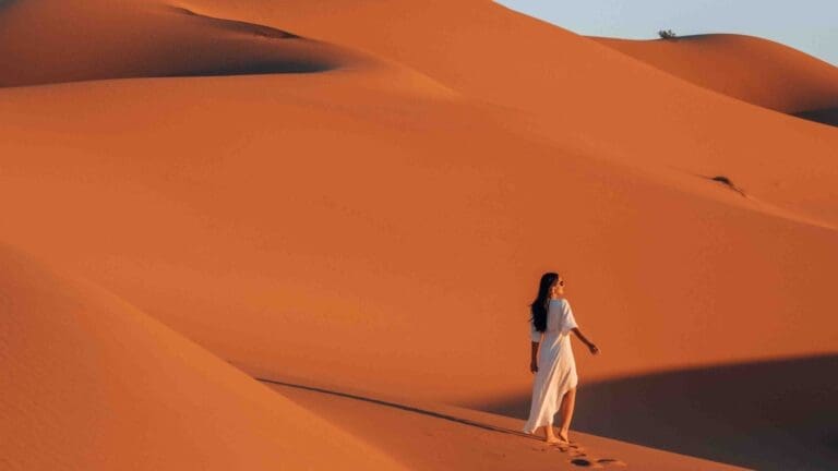 woman walking in desert