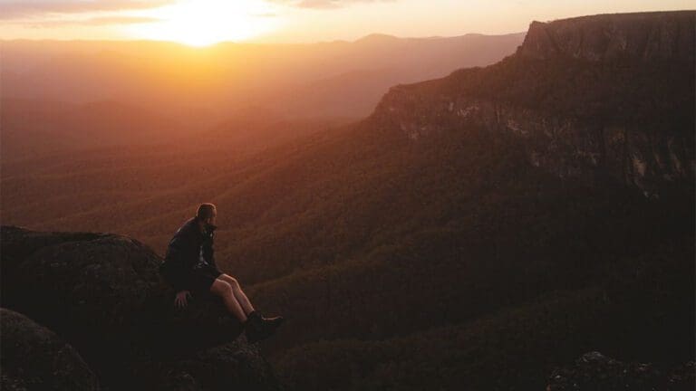 man looking out to mountain landscape.jpg
