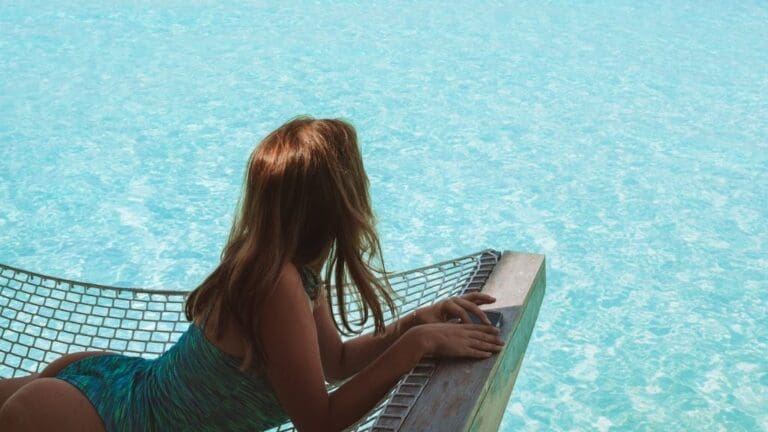 woman on hammock looking out to sea