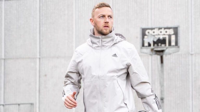 man wearing grey tracksuit top