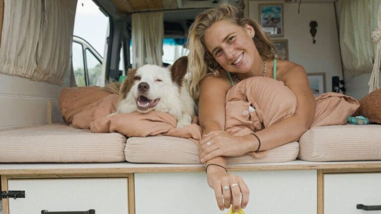 woman and dog in camper van
