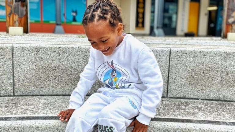 young boy in bugs bunny jumper