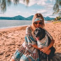 woman on beach with dog